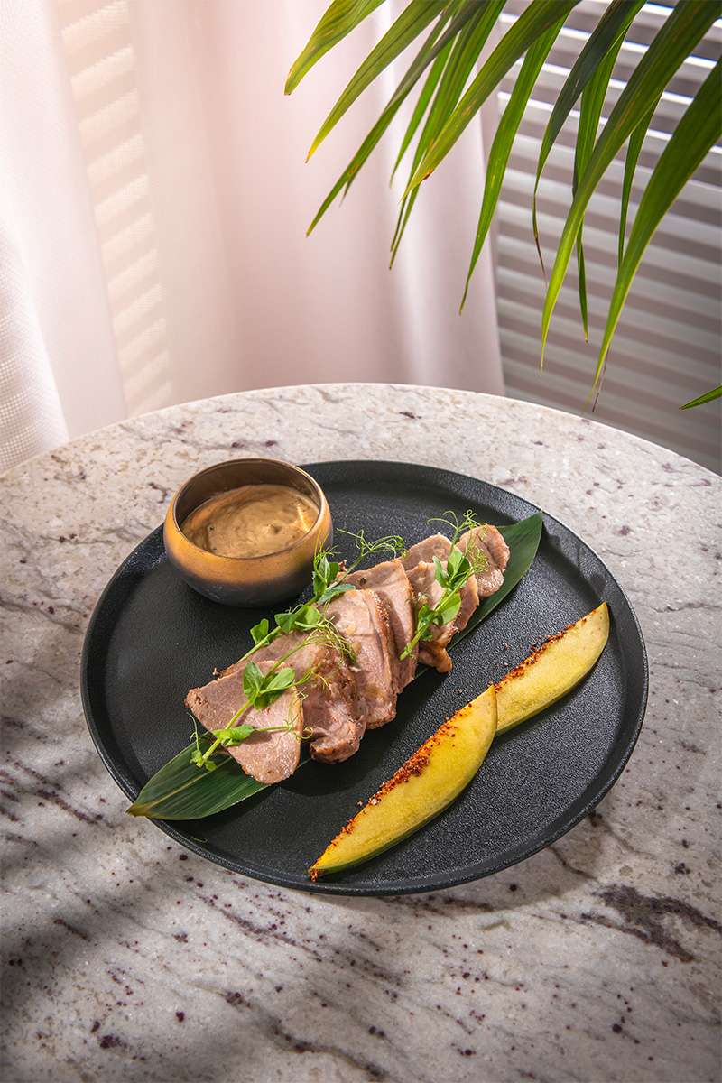 Iberian acorn-fed pork shoulder with Moorish mojo sauce and mango