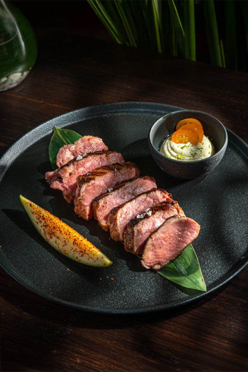 Iberian acorn-fed pork with mojo moruno sauce and mango